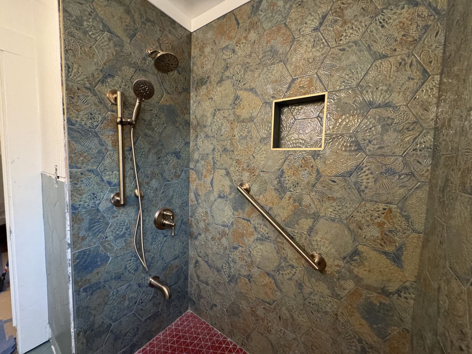 Custom tile work in a remodeled bathroom