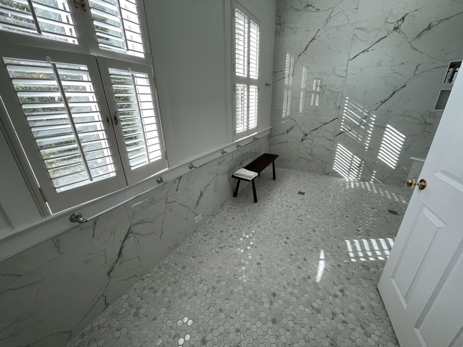 Renovated bathroom with a walk-in tiled shower